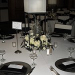 Black stand with shade complimented by a white and black arrangement.