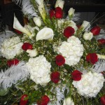 Funeral piece of red and white with feathers. Funeral piece of red and white with feathers.
