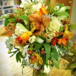 Distinctive bridal bouquet with Kale, Dusty Miller, and Cymbidium Orchids.