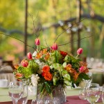 A fresh, springtime garden centerpiece in a square glass vase.