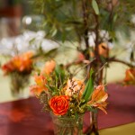 Votives filled with flowers are sweet favors for guests and add color to the table.