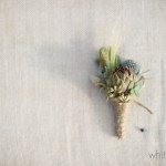 Succulent boutonniere finished with twine.