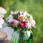 Beautiful, soft, and romantic, this bouquet features garden flowers in peaches and corals with succulent and metallic accents.