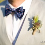 Mat displays his boutonniere of succulents, metallic Billy Balls, and greenery.