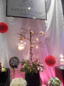 A gorgeous bronzed wrought iron tree with hanging votives.