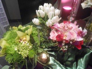 A collection of spring bouquets in shades of green, white tulips, and shades of pink.