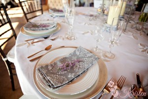 A sprig of Heather adds the finishing touch to an elegant place setting. Photo by: Photography by Kristen