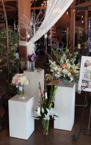 This grouping of plaster pillars showcases beautiful bouquets and arrangements.