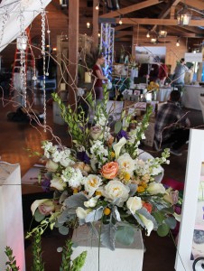 Arrangement of premium flowers in a mercury glass urn.
