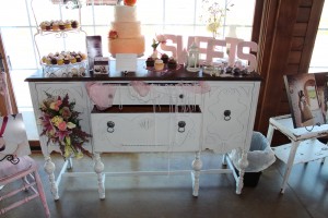 Adorable buffet as a sweets display in pinks and peaches.