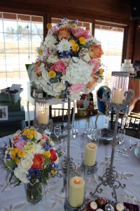 These distressed, crystal embellished candlesticks are perfect combined with romantic wildflower centerpieces in cream, coral, blush, yellow, and blue.