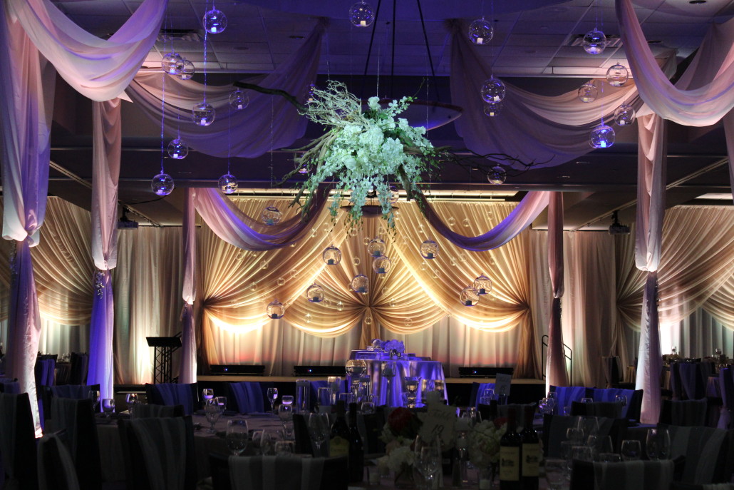 The entire room was draped in floor to ceiling drape, with specialty backdrops and doorway treatments accenting the room.