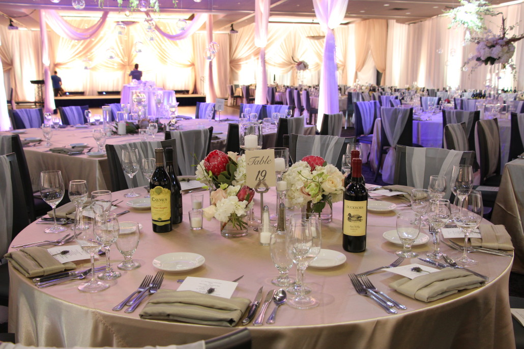 A coordinating look with roses, hydrangeas, orchids and blush pink protea.