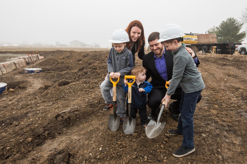 Erin, husband Brandon, and boys Lucas, Nathan, and Joshua break ground.