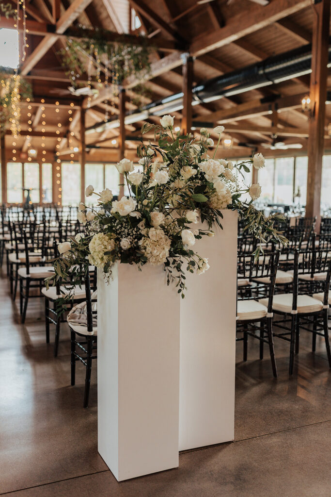 pillars with floral arrangements