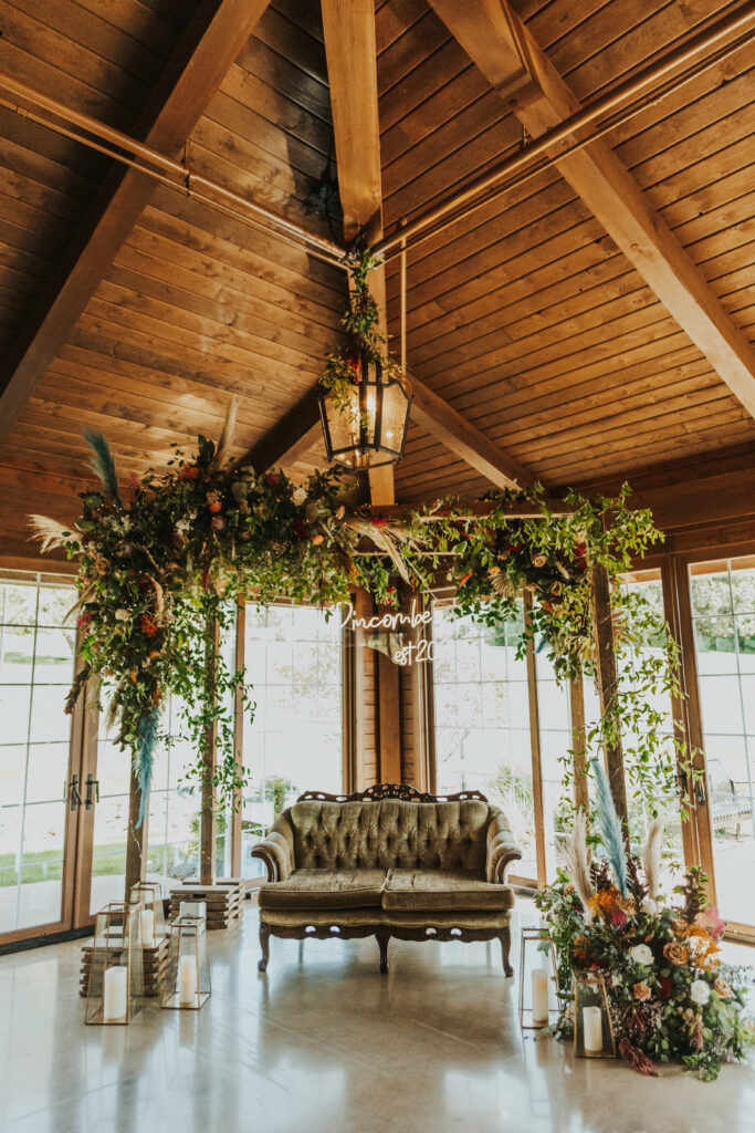 Wedding flowers on arch and around love seat