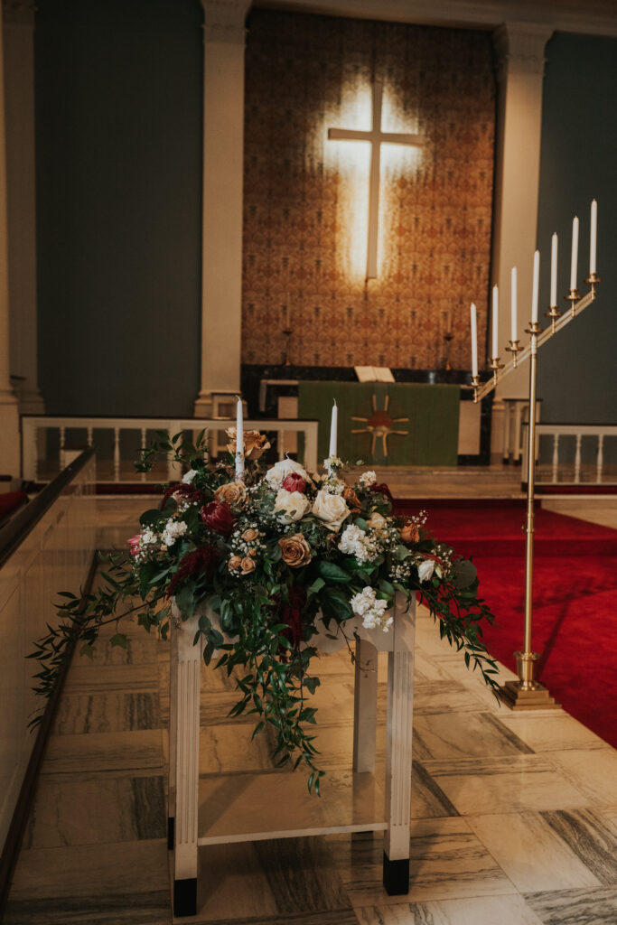 Wedding flowers in a church for unity candles